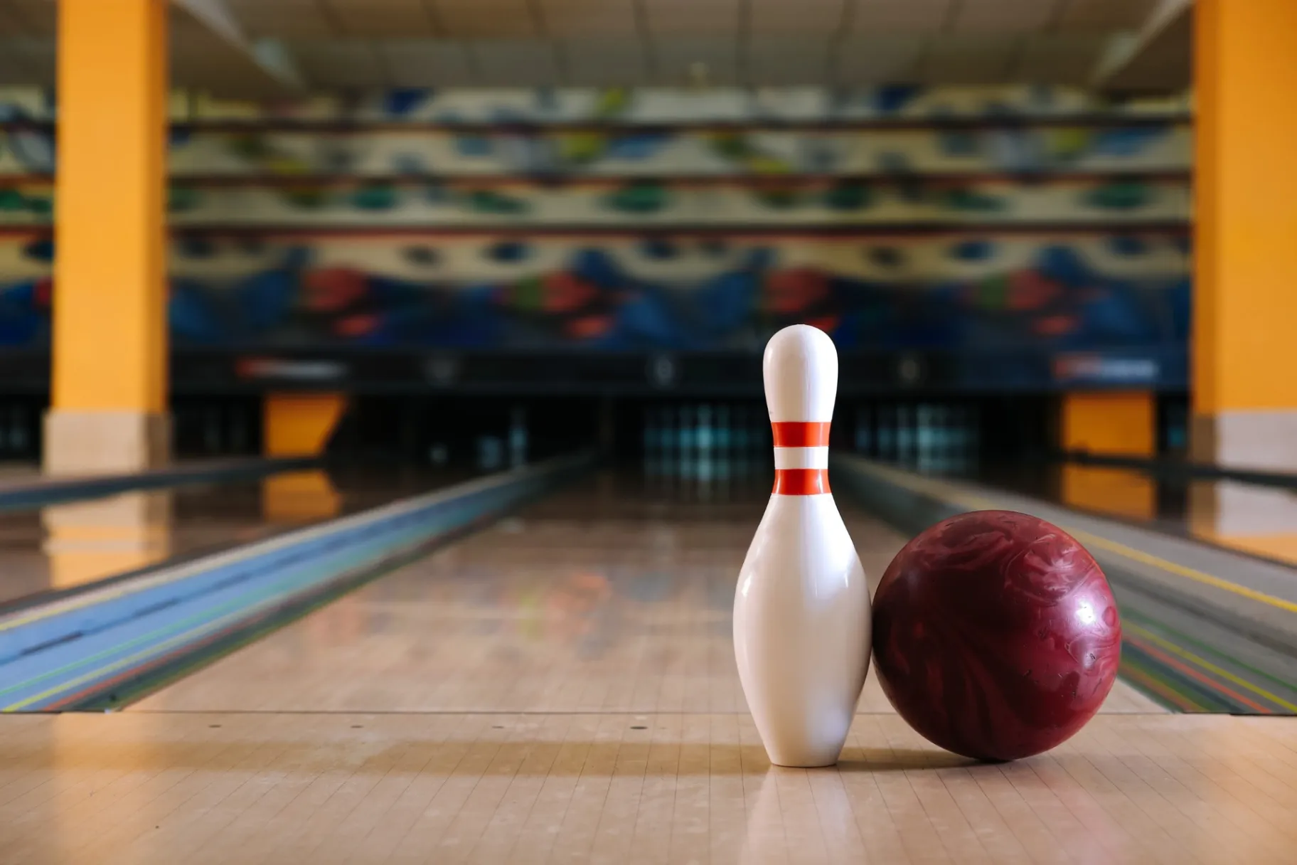 Pin and ball on floor in bowling club Pin and ball on floor in bowling club